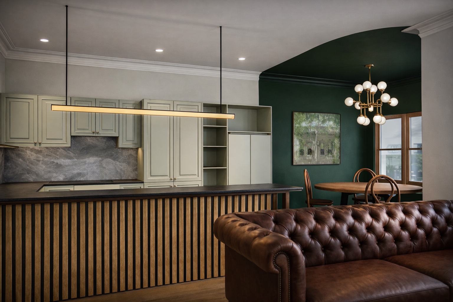 The relocated kitchen in a soft green, with the dining area in a deep heritage green
